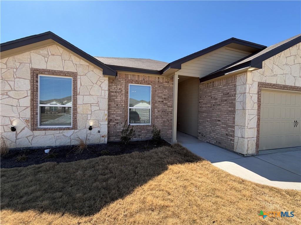 3008 Seeker Street Killeen, TX 76549 - Photo 3 of 25 a front view of a house with a yard