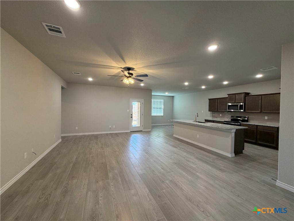 3008 Seeker Street Killeen, TX 76549 - Photo 4 of 25 a view of kitchen with refrigerator and microwave