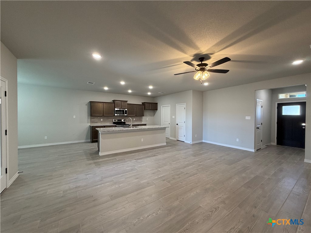 3008 Seeker Street Killeen, TX 76549 - Photo 5 of 25 a view of kitchen with kitchen island a sink and wooden floor