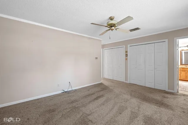 a bathroom with a granite countertop double vanity sink toilet mirror and bathtub