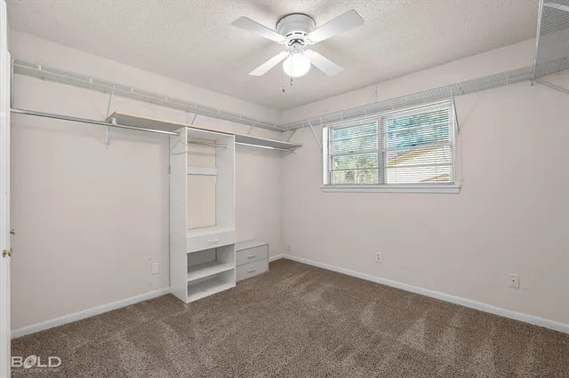 a bathroom with a sink a large mirror and a window