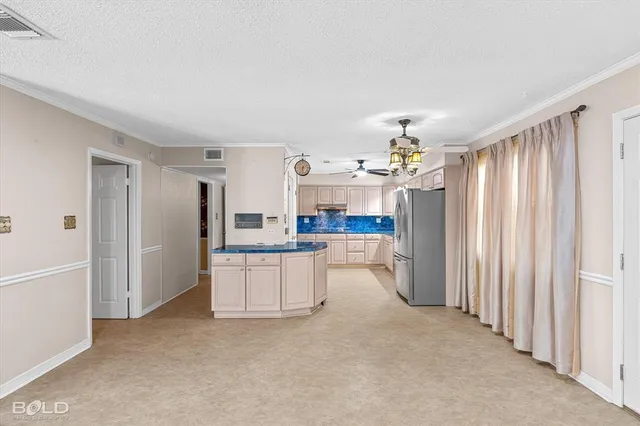 a kitchen with granite countertop a sink stainless steel appliances and cabinets