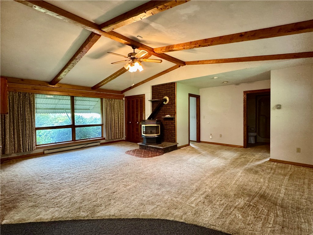 988 Swart Hollow Road Oneonta, NY 13820 - Photo 12 of 47 living room with pellet stove