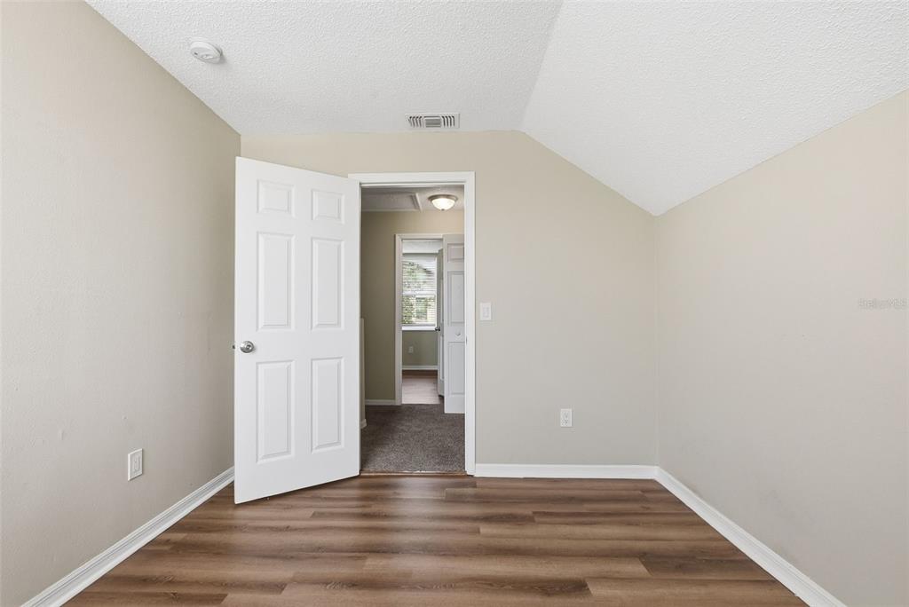 617 Greys Ferry Road Orlando, FL 32811 - Photo 20 of 35 a view of an empty room with wooden floor and closet