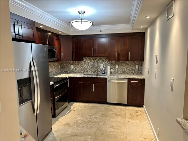 a living room with furniture and a lamp