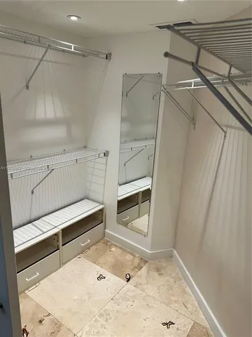 a view of staircase with white walls