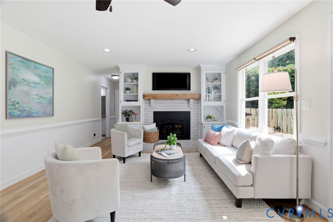2904 Old Gun Road West Midlothian, VA 23113 - Photo 19 of 59 Living area featuring a white brick fireplace with