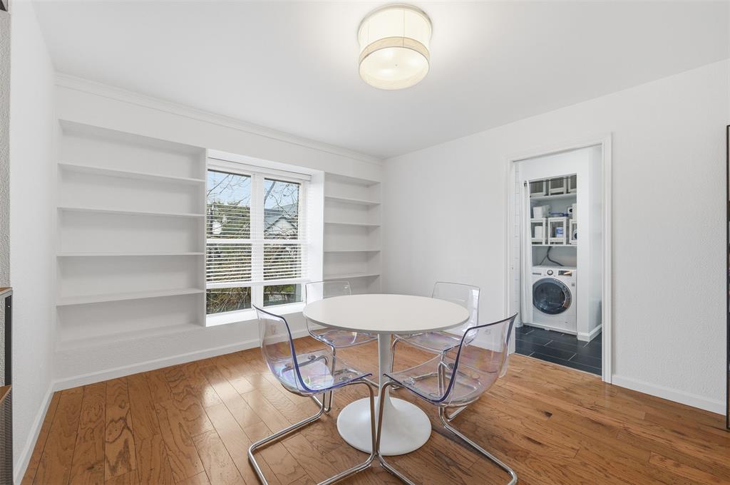 4837 Cedar Springs Road, Unit 311 Dallas, TX 75219 - Photo 6 of 17 Dining room with built in features, hardwood / wood-style floors, and washer / clothes dryer