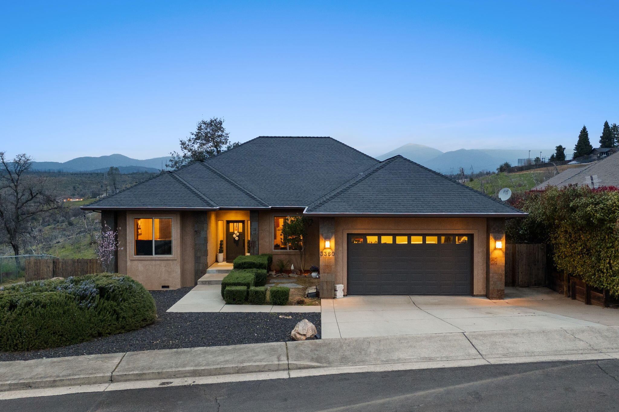 3360 Stanford Drive Redding, CA 96003 - Photo 2 of 56 a front view of a house with a yard and garage