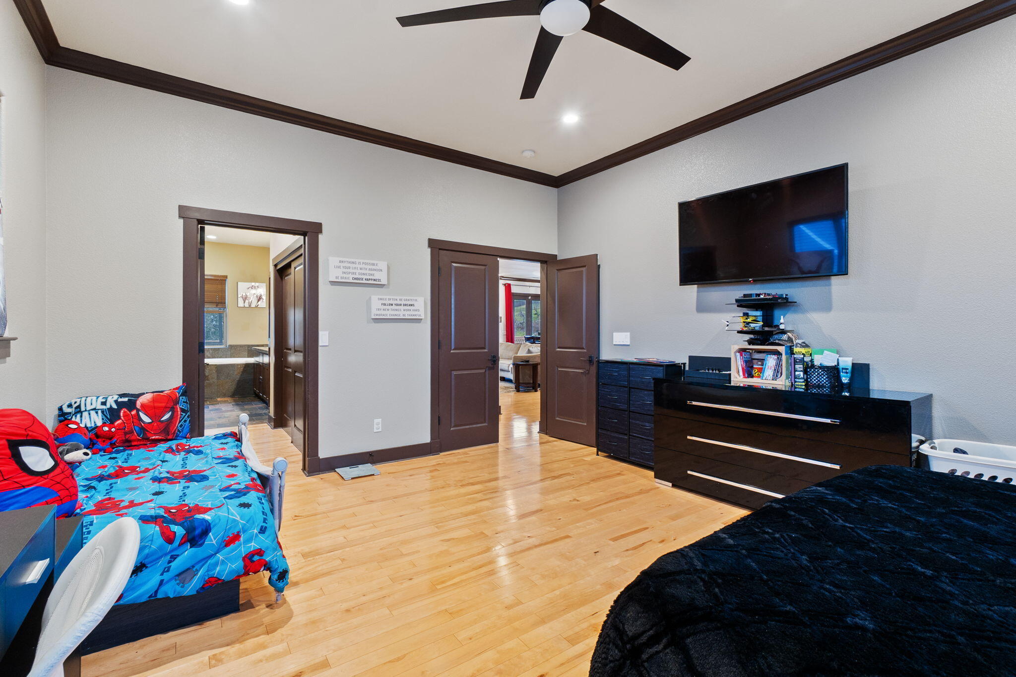 3360 Stanford Drive Redding, CA 96003 - Photo 21 of 56 a bedroom with a bed and a flat screen tv