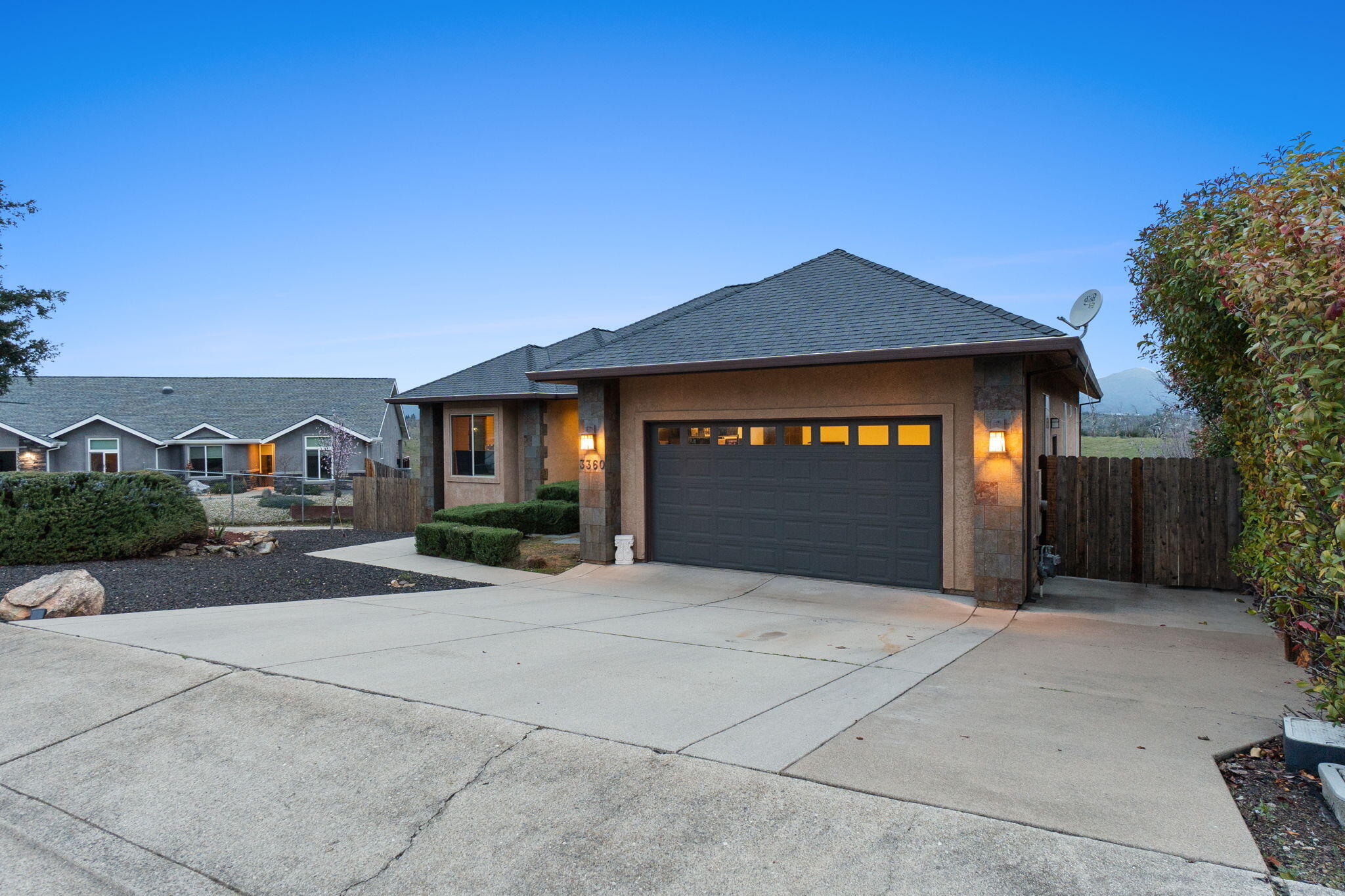 3360 Stanford Drive Redding, CA 96003 - Photo 53 of 56 a front view of a house with a yard and garage