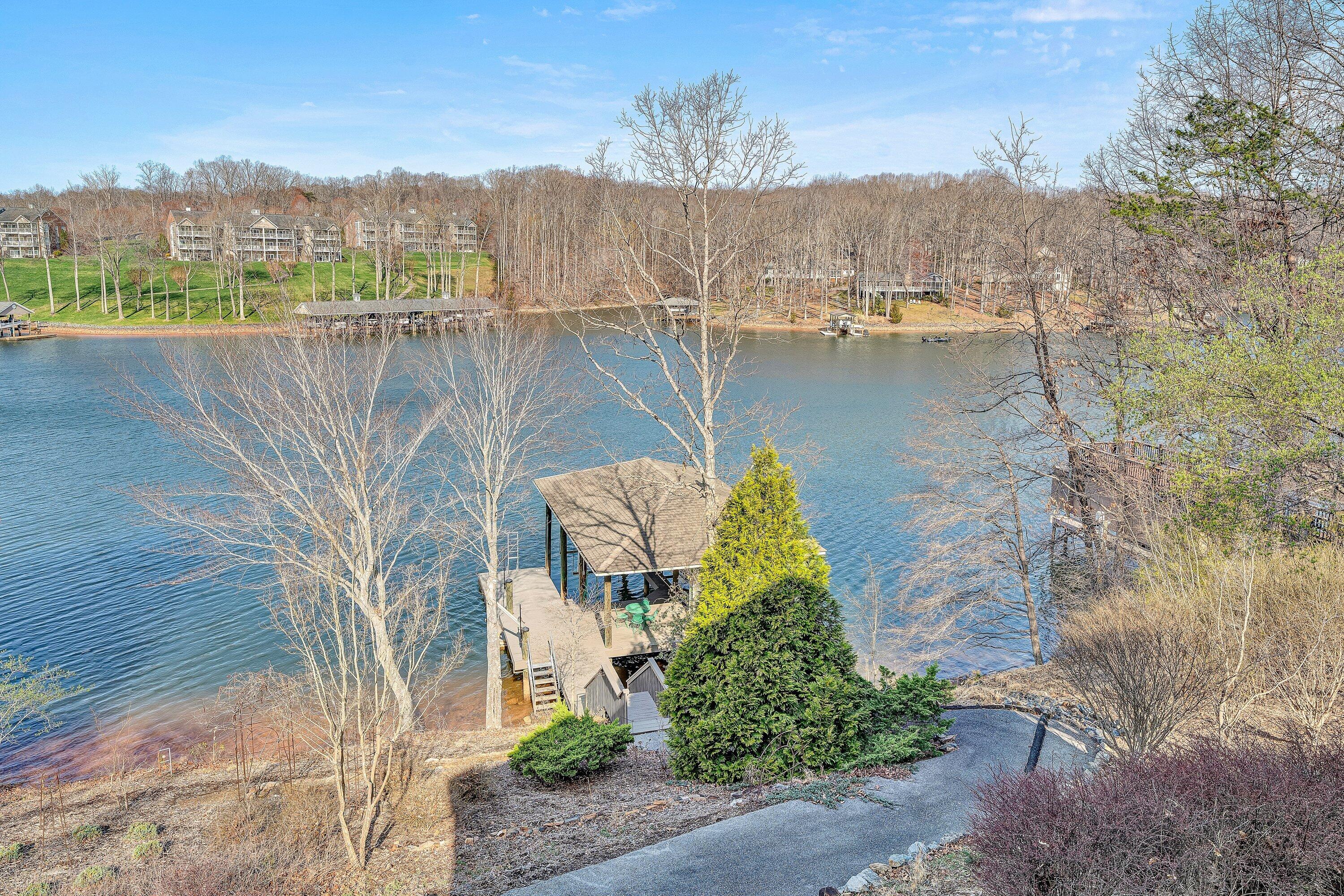 23 Waterpoint Court Moneta, VA 24121 - Photo 13 of 38 a view of a lake with a mountain in the background