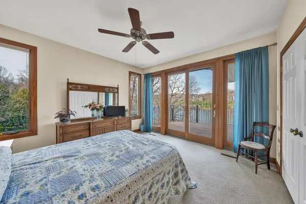 a bedroom with a large bed and a large window