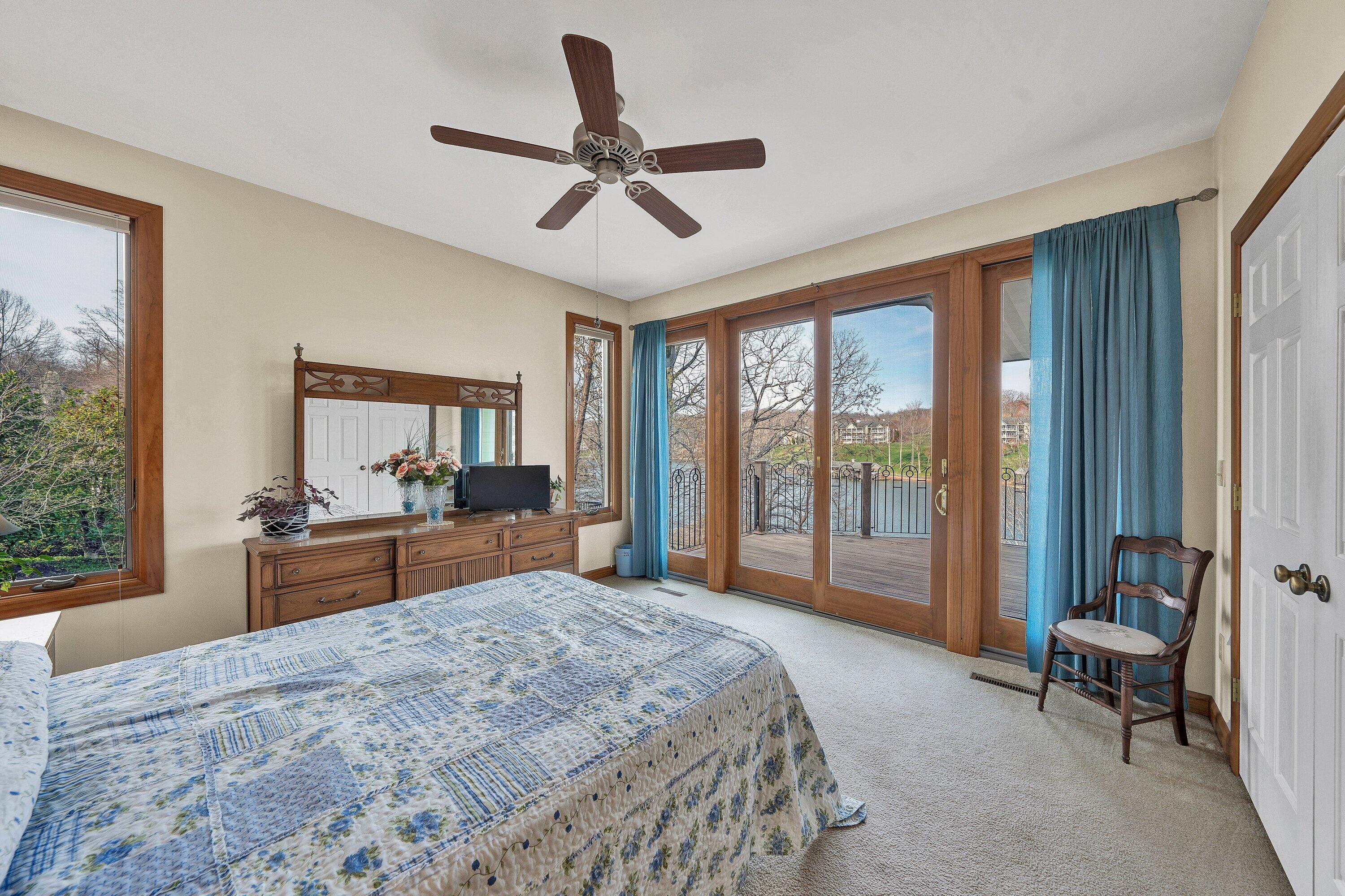 23 Waterpoint Court Moneta, VA 24121 - Photo 15 of 38 a bedroom with a large bed and a large window