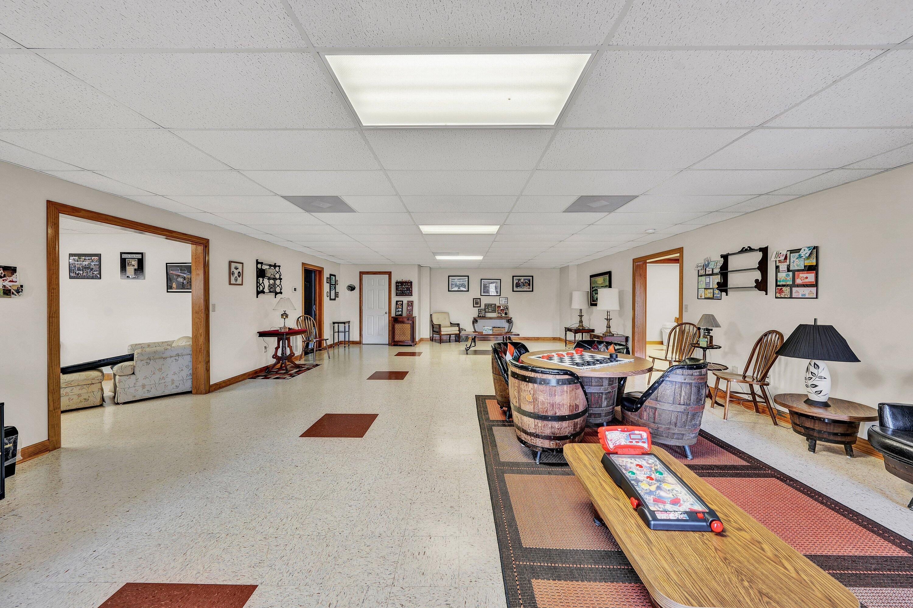 23 Waterpoint Court Moneta, VA 24121 - Photo 25 of 38 a living room with furniture a rug and gym equipment