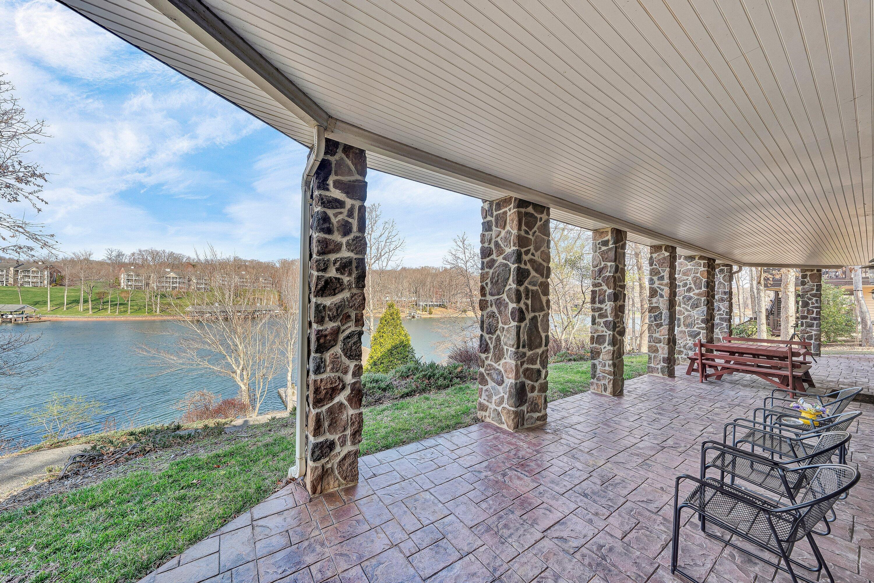 23 Waterpoint Court Moneta, VA 24121 - Photo 29 of 38 a view of a patio with a table chairs and backyard