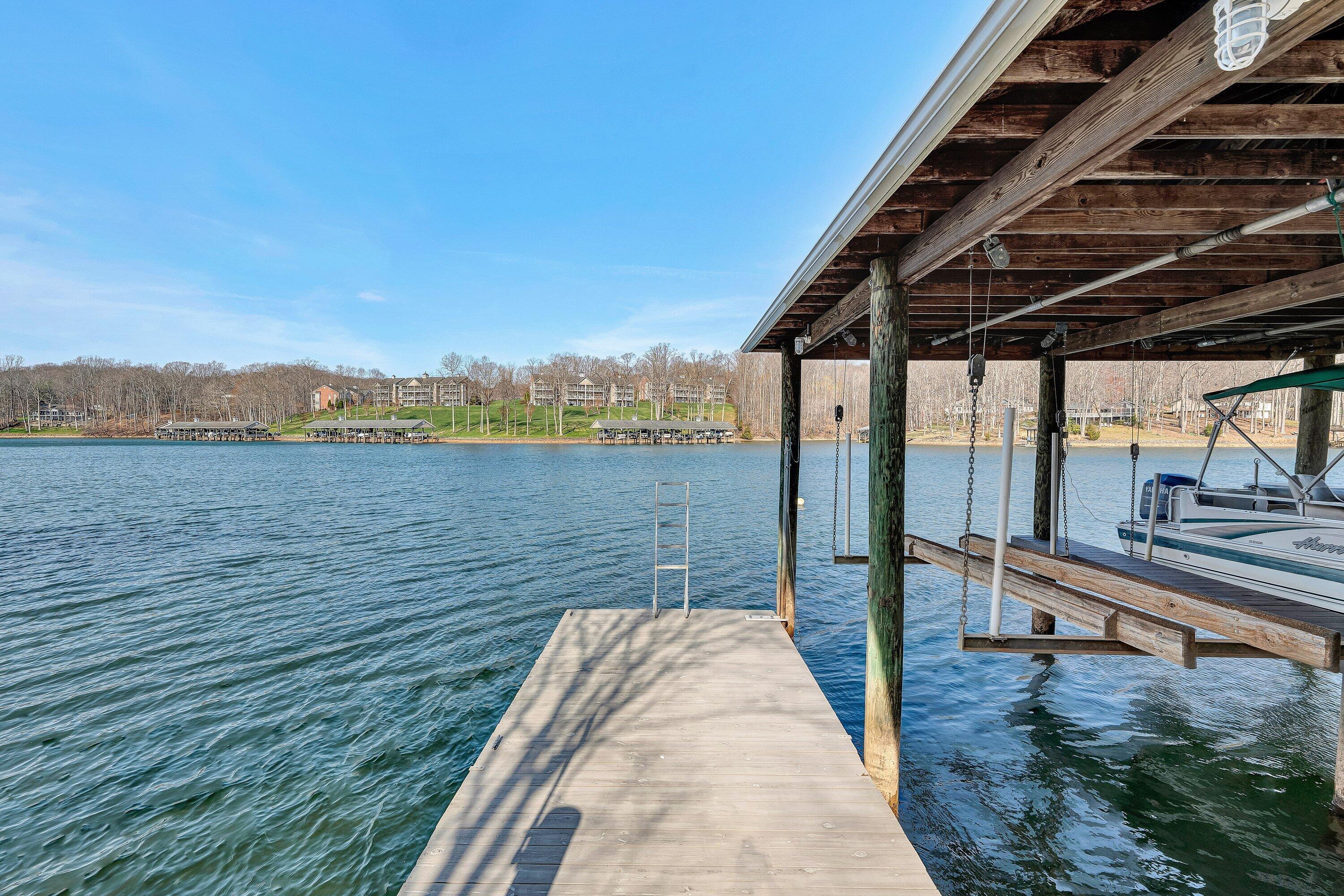 23 Waterpoint Court Moneta, VA 24121 - Photo 36 of 38 a view of a lake from a balcony
