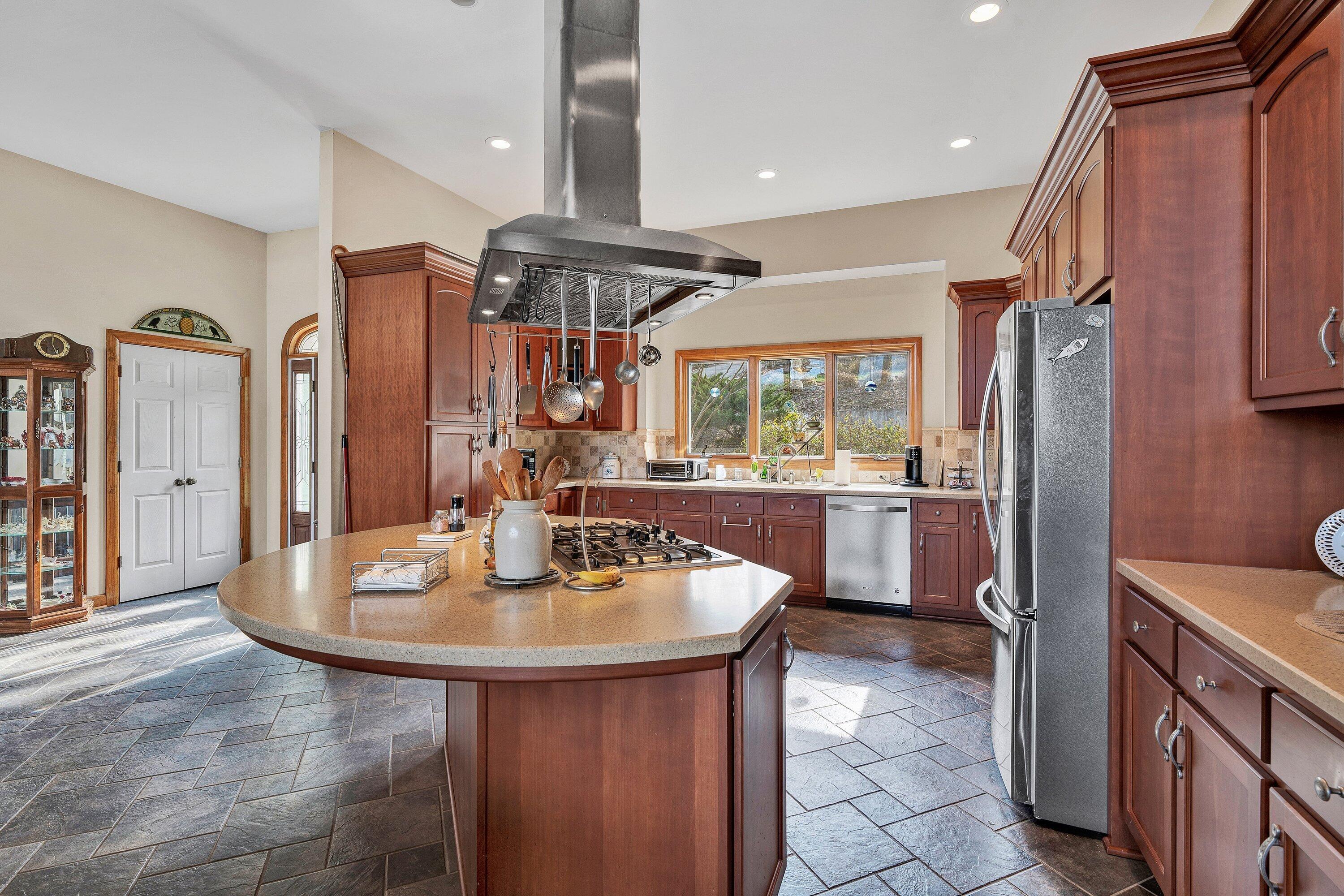 23 Waterpoint Court Moneta, VA 24121 - Photo 6 of 38 a kitchen with stainless steel appliances granite countertop a sink a refrigerator and a stove