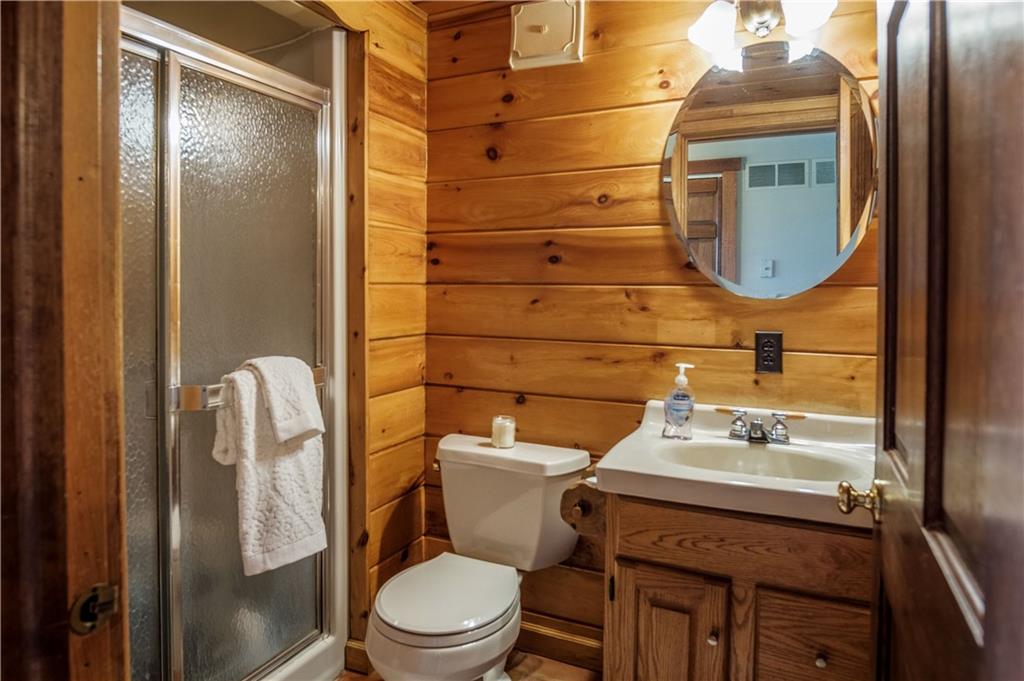 411 Rohrmann Road Darlington, PA 16115 - Photo 11 of 25 a bathroom with a toilet a sink and mirror