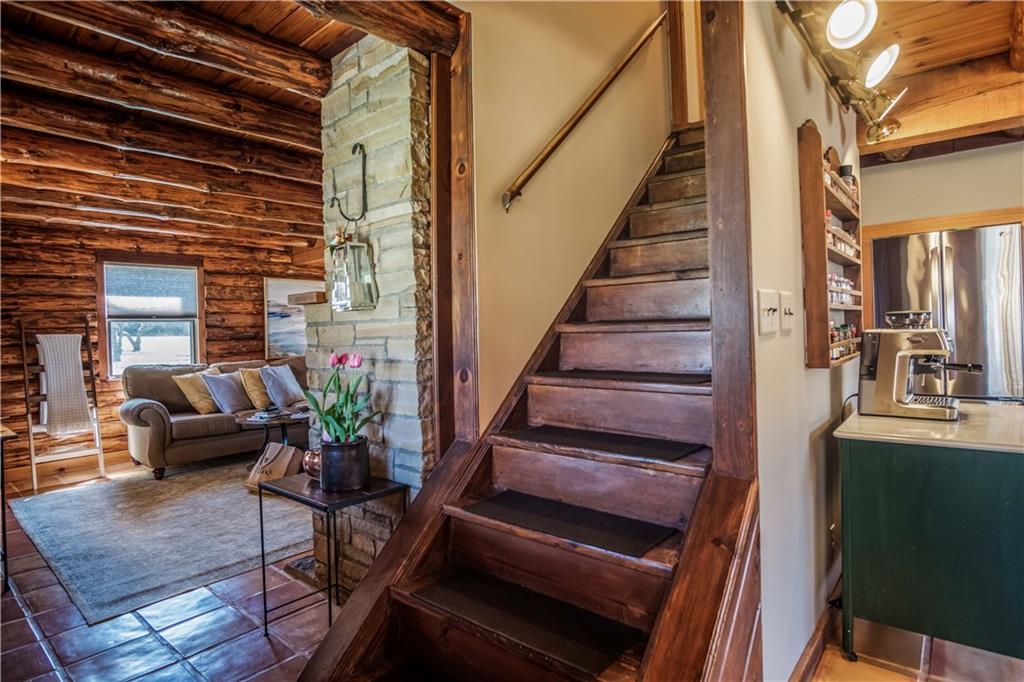 411 Rohrmann Road Darlington, PA 16115 - Photo 3 of 25 a view of staircase with wooden floor and a potted plant