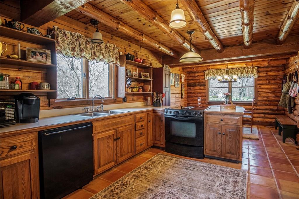 411 Rohrmann Road Darlington, PA 16115 - Photo 7 of 25 a kitchen with a sink and cabinets