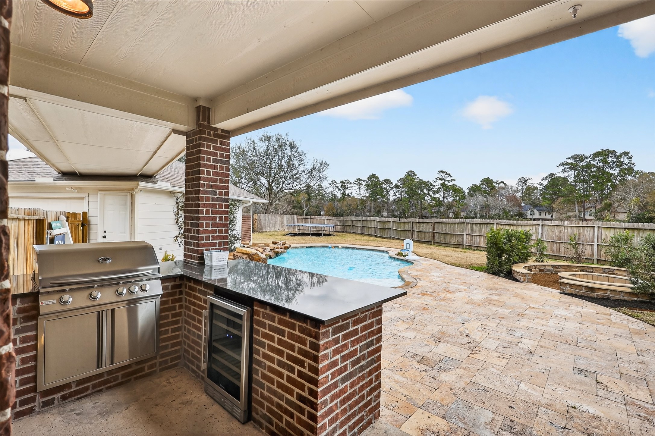46 New Dawn Place Conroe, TX 77385 - Photo 33 of 39 CUSTOM outdoor kitchen with BEVERAGE fridge and GRILL!