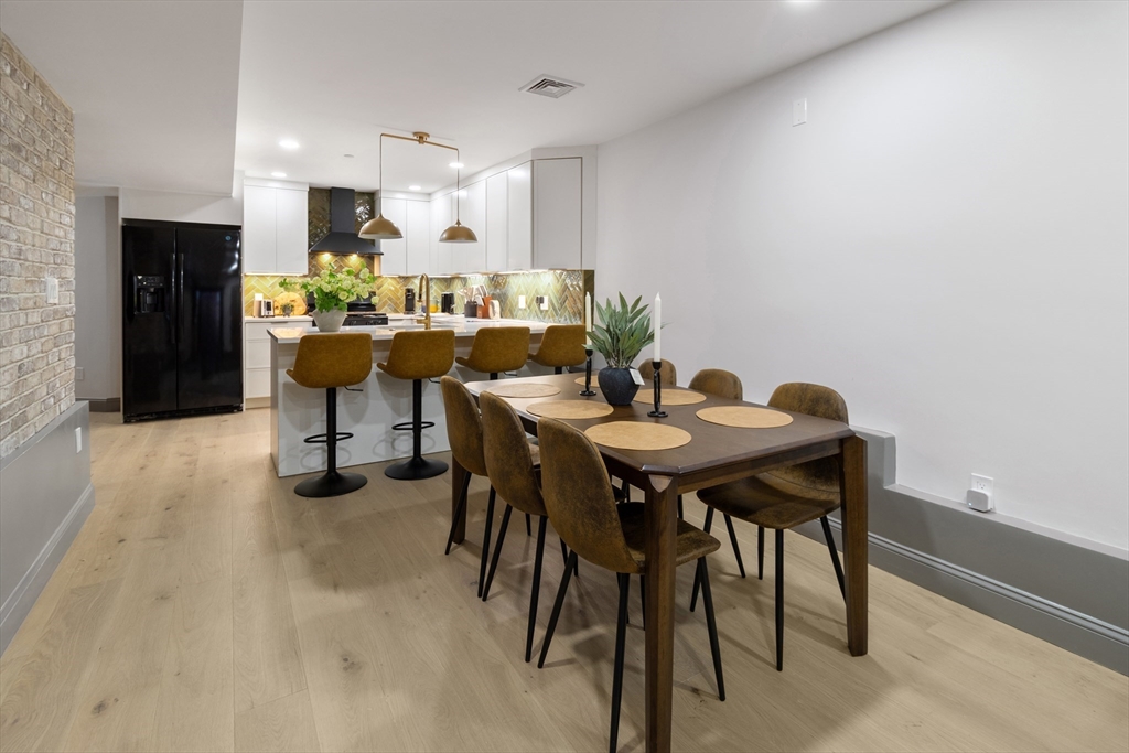 4 Snelling Place, Unit 4 Boston, MA 02113 - Photo 3 of 15 a view of a dining room with furniture