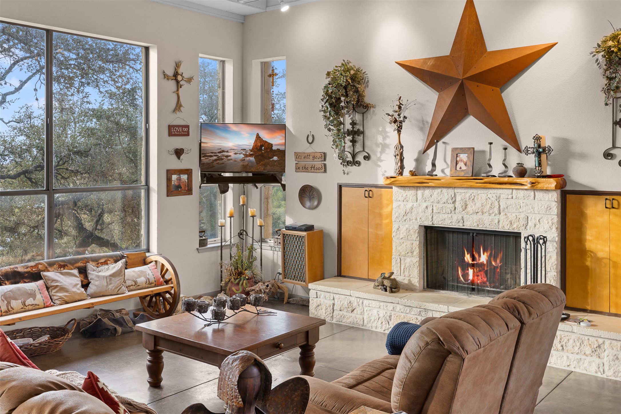 27701 Turner Ranch Road Marble Falls, TX 78654 - Photo 7 of 40 Living room featuring a fireplace and concrete flooring