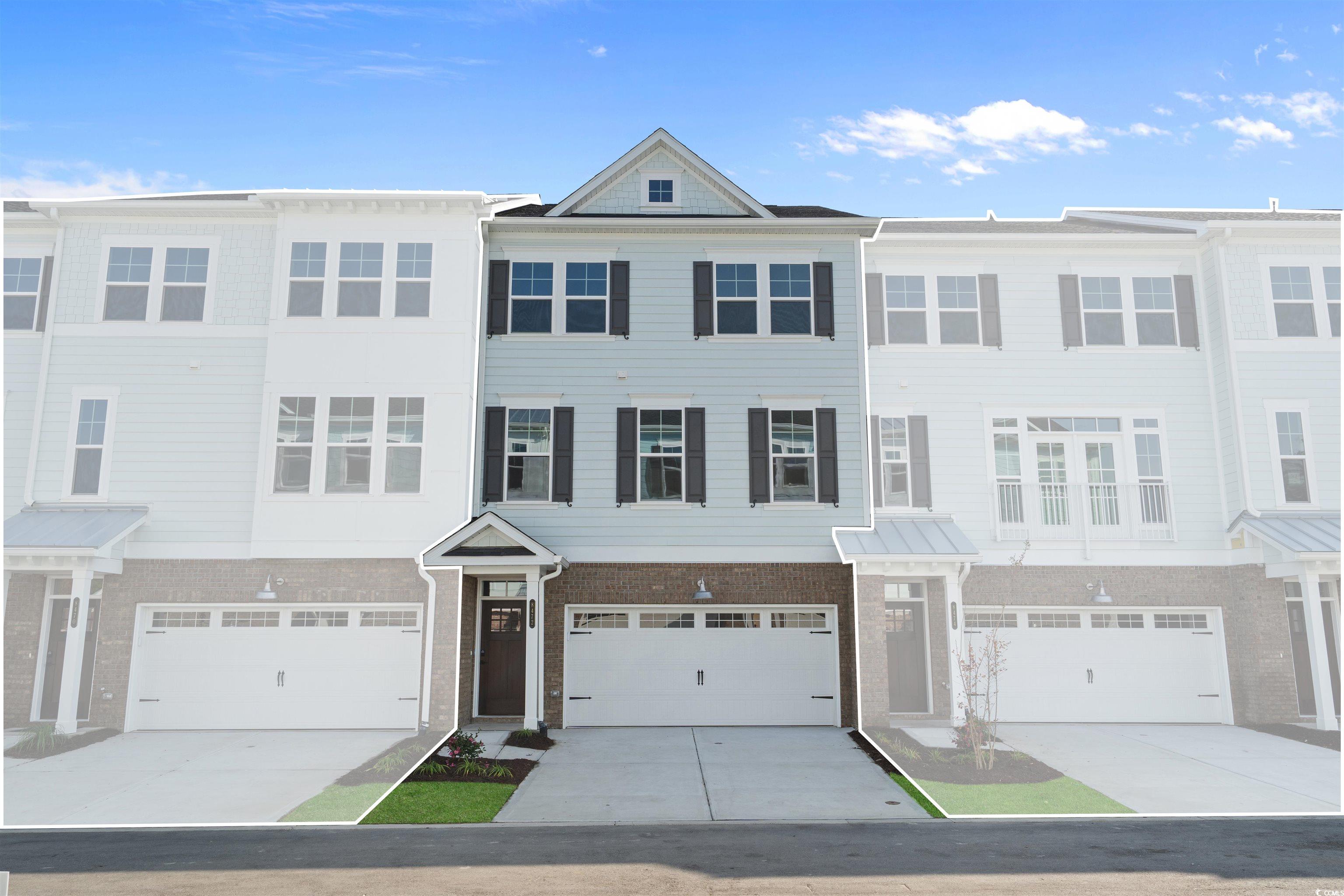 8472 Duke Place, Unit 30 Myrtle Beach, SC 29572 - Photo 1 of 40 View of front of home with brick siding, concrete driveway, and an attached garage
