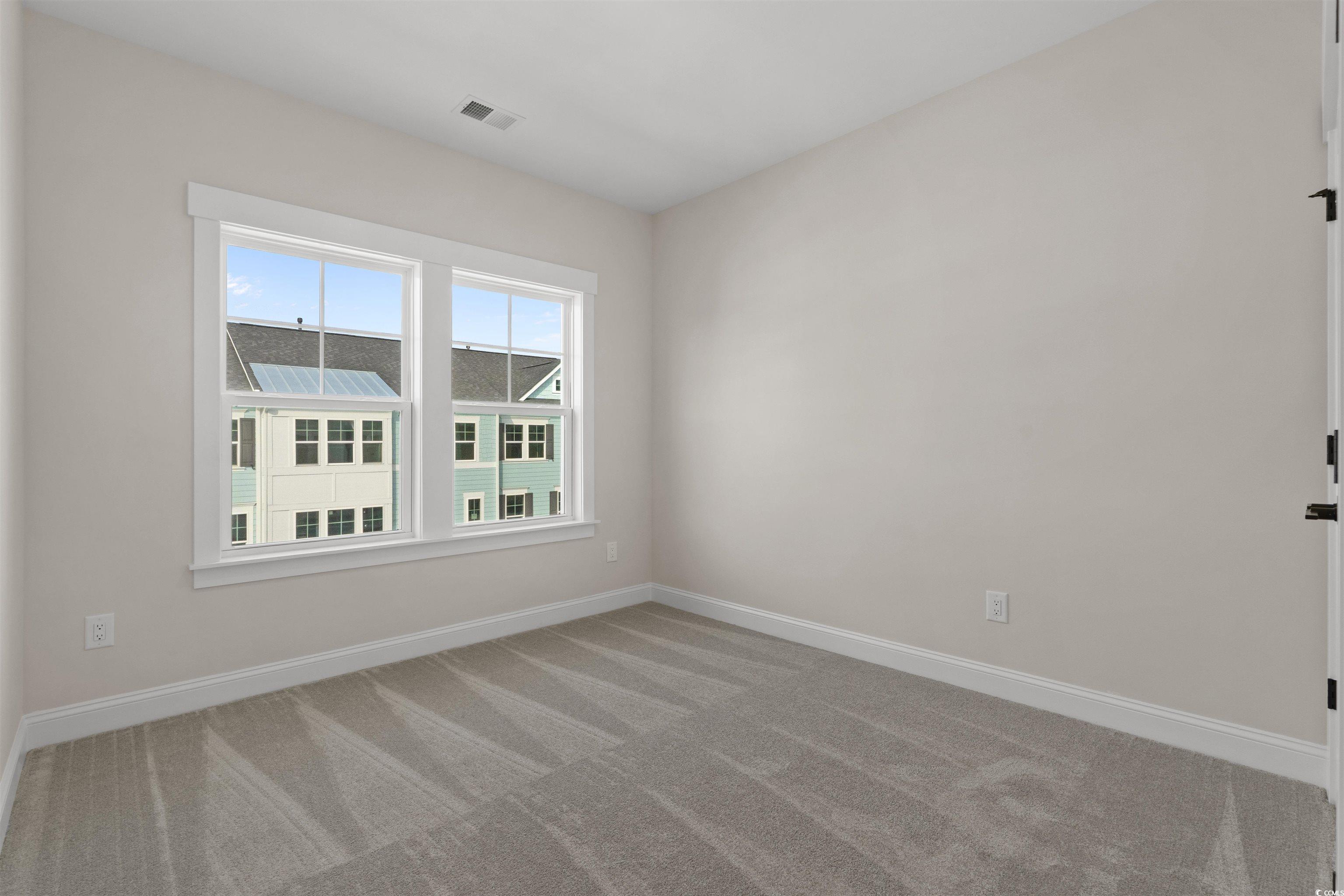 8472 Duke Place, Unit 30 Myrtle Beach, SC 29572 - Photo 31 of 40 Unfurnished room with baseboards and light colored carpet