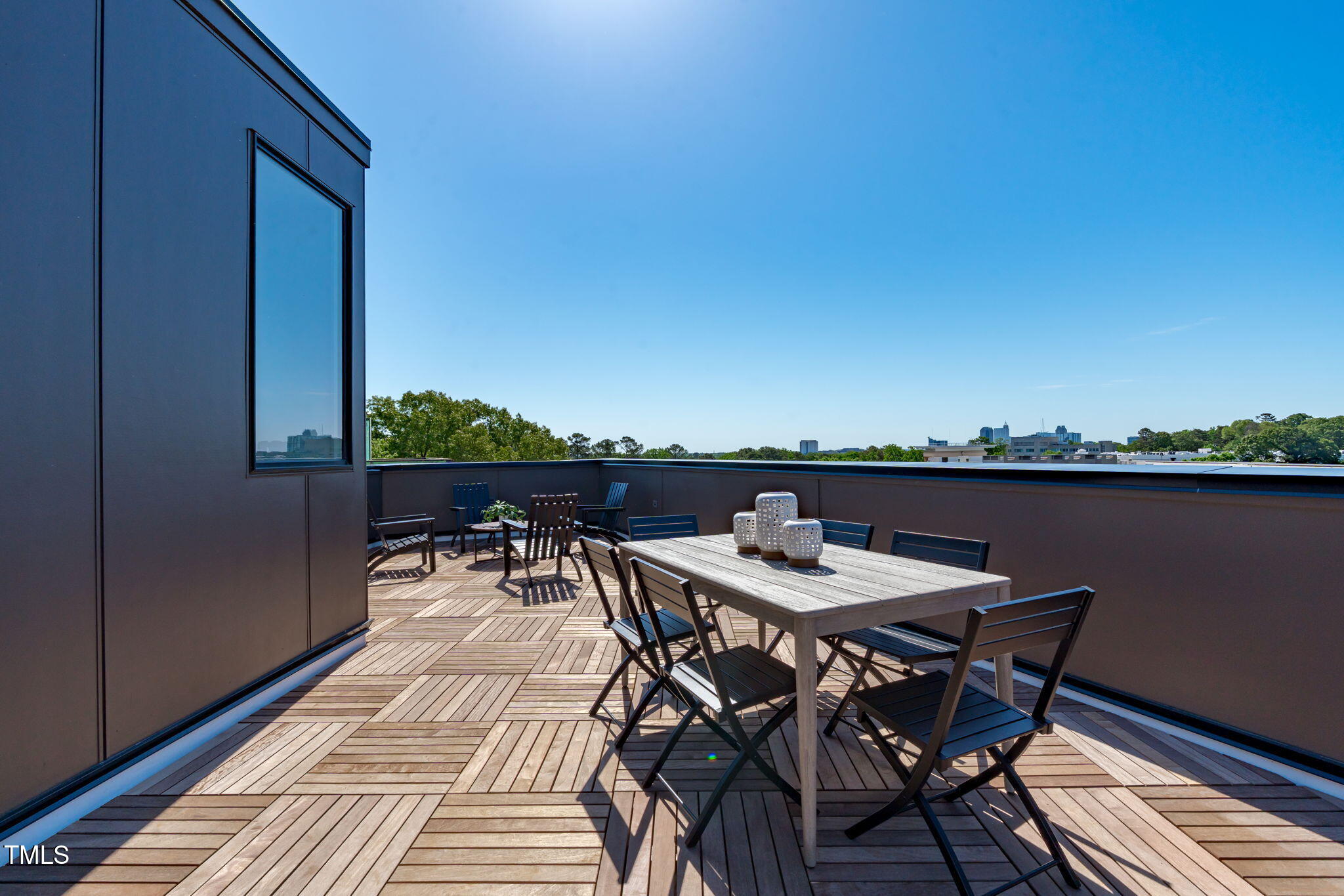 1303 Chamblee Hill Raleigh, NC 27608 - Photo 32 of 49 a view of a dinning table and chairs on roof deck