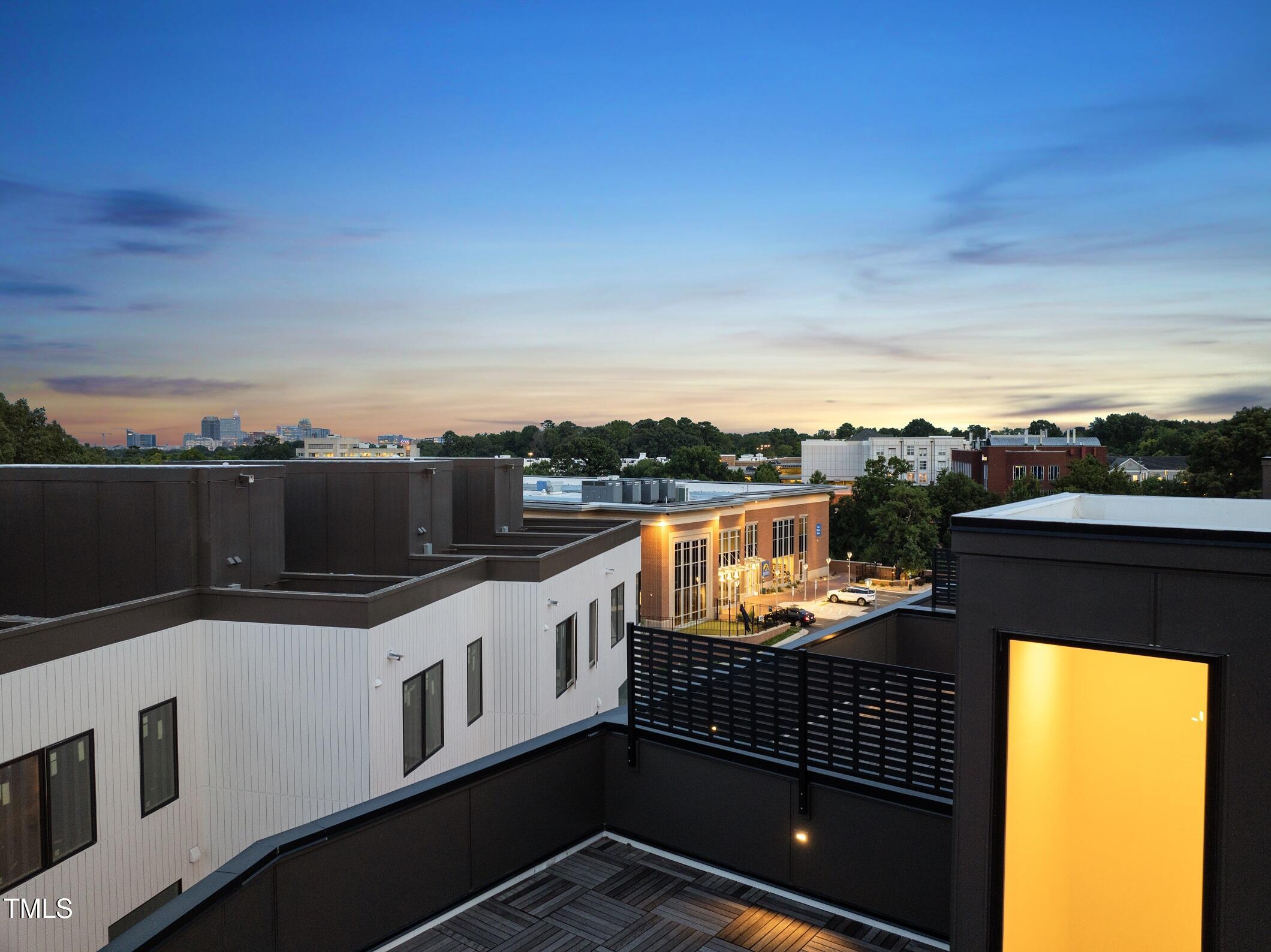 1303 Chamblee Hill Raleigh, NC 27608 - Photo 42 of 49 a balcony with a city view