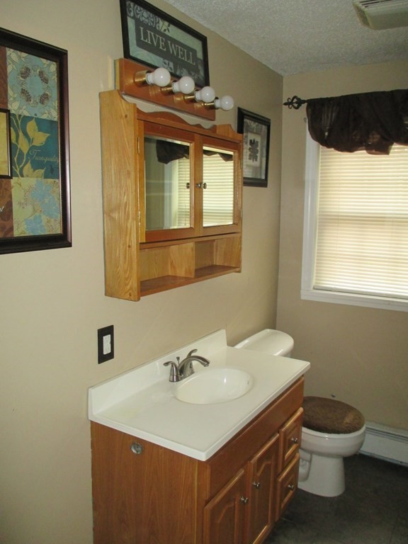 35 School House Road Phillipston, MA 01331 - Photo 18 of 32 a bathroom with a sink a toilet and mirror