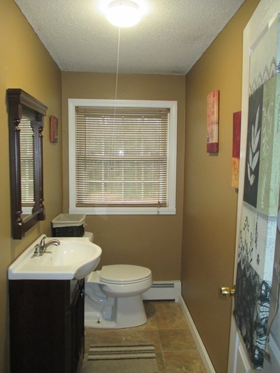 35 School House Road Phillipston, MA 01331 - Photo 27 of 32 a bathroom with a sink toilet and shower