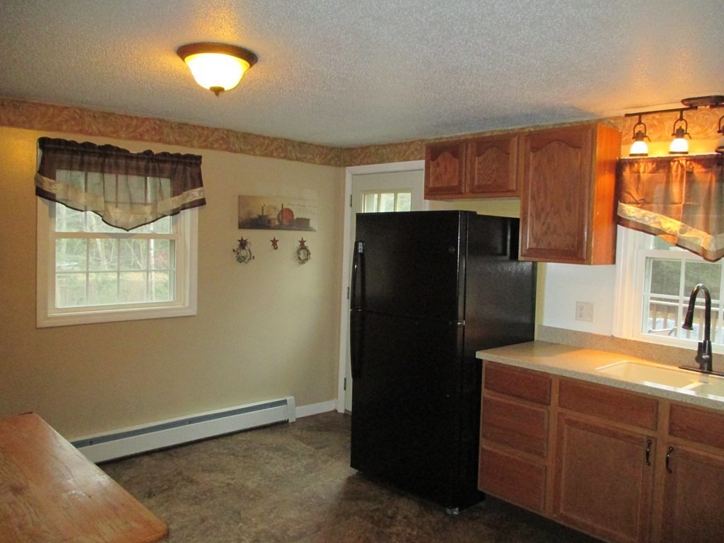 35 School House Road Phillipston, MA 01331 - Photo 6 of 32 a kitchen with stainless steel appliances granite countertop a refrigerator and a sink