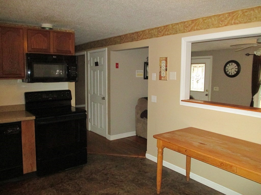 35 School House Road Phillipston, MA 01331 - Photo 8 of 32 a hallway with cabinets and a wooden floor