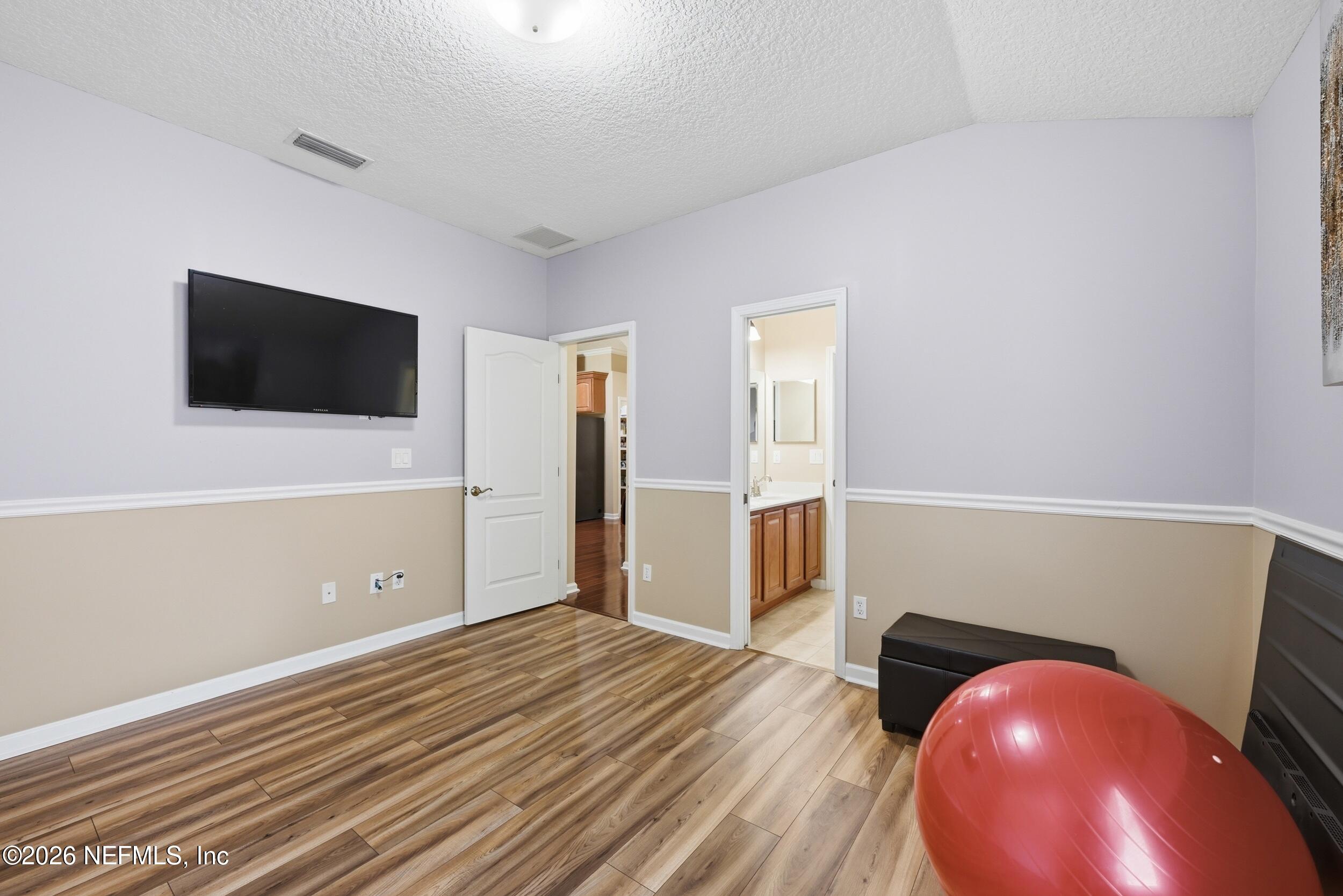 86178 Sand Hickory Trail Yulee, FL 32097 - Photo 12 of 23 a view of a livingroom with wooden floor and workspace