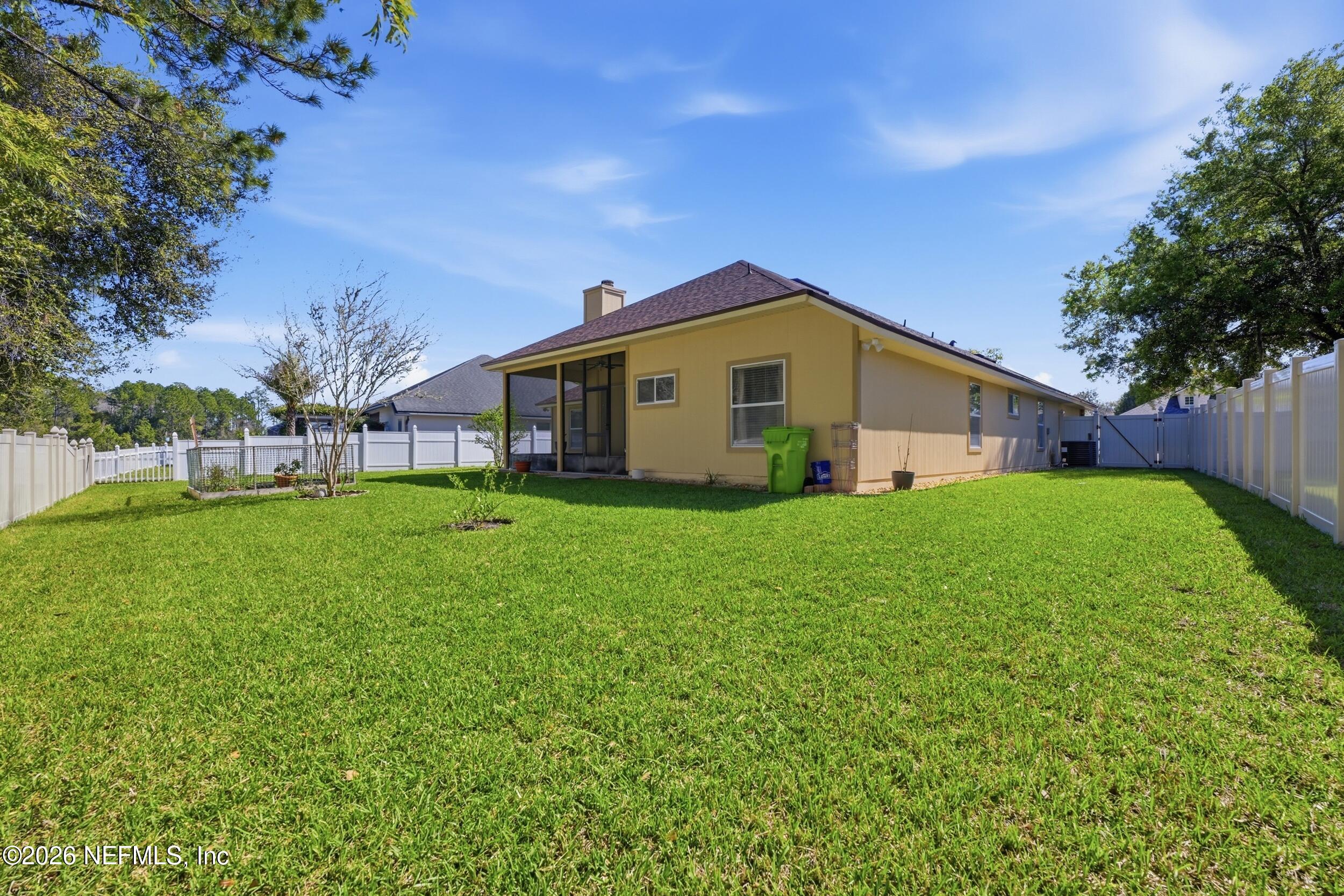 86178 Sand Hickory Trail Yulee, FL 32097 - Photo 22 of 23 a front view of house with yard and green space