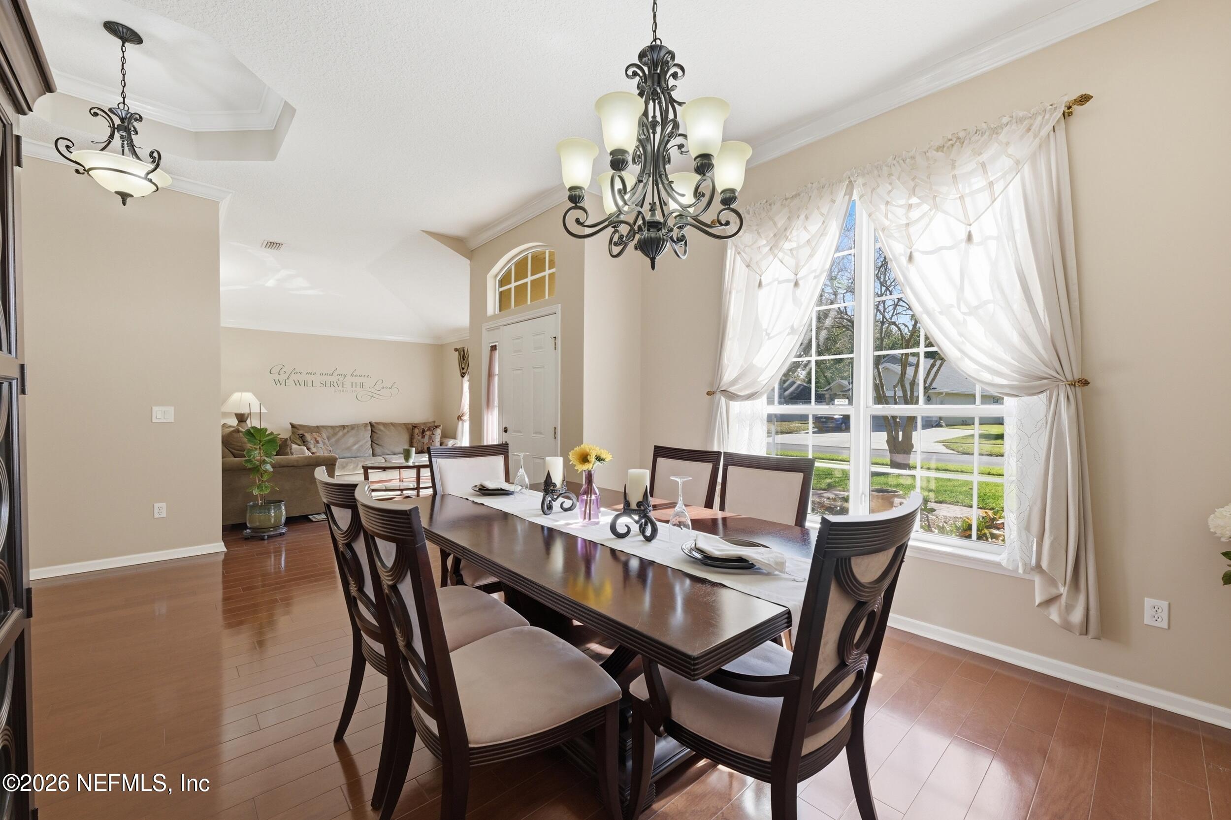 86178 Sand Hickory Trail Yulee, FL 32097 - Photo 5 of 23 a view of a dining room with furniture window and wooden floor