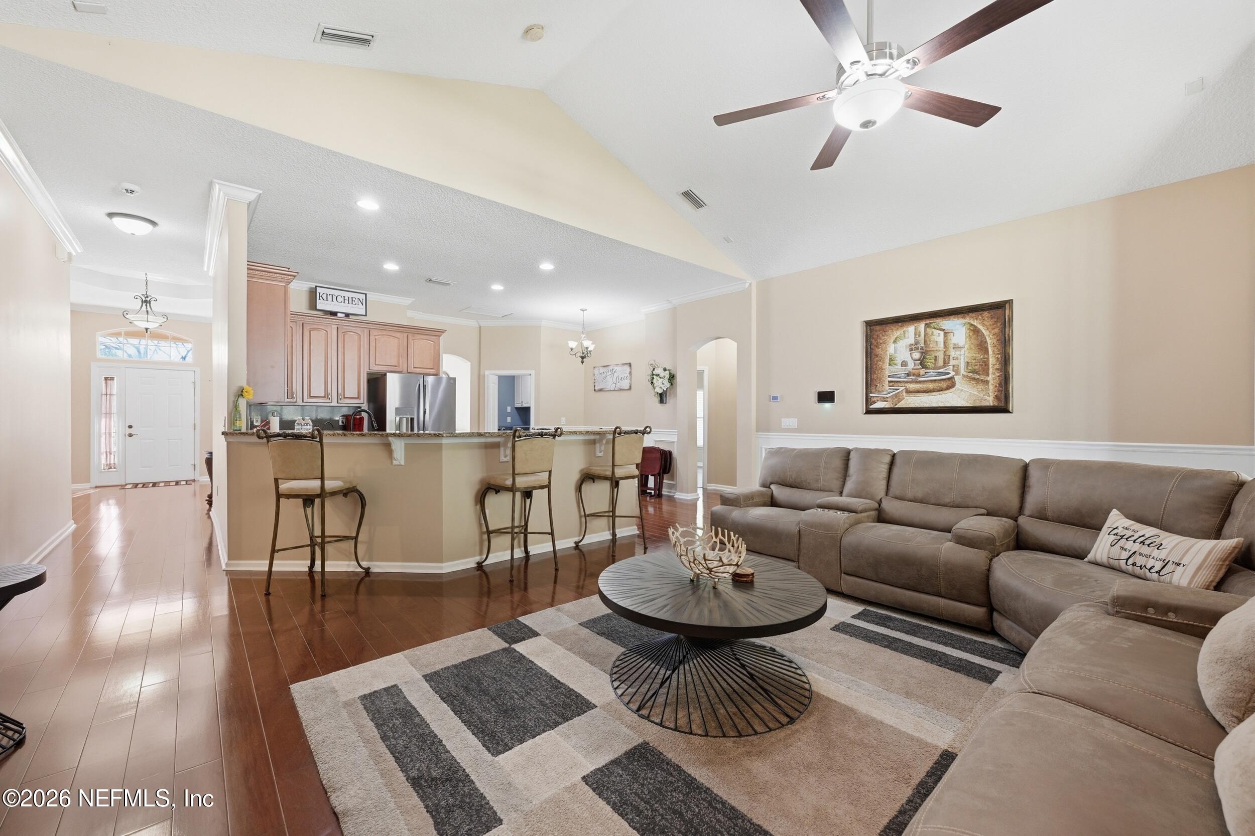 86178 Sand Hickory Trail Yulee, FL 32097 - Photo 6 of 23 a living room with furniture and a view of kitchen