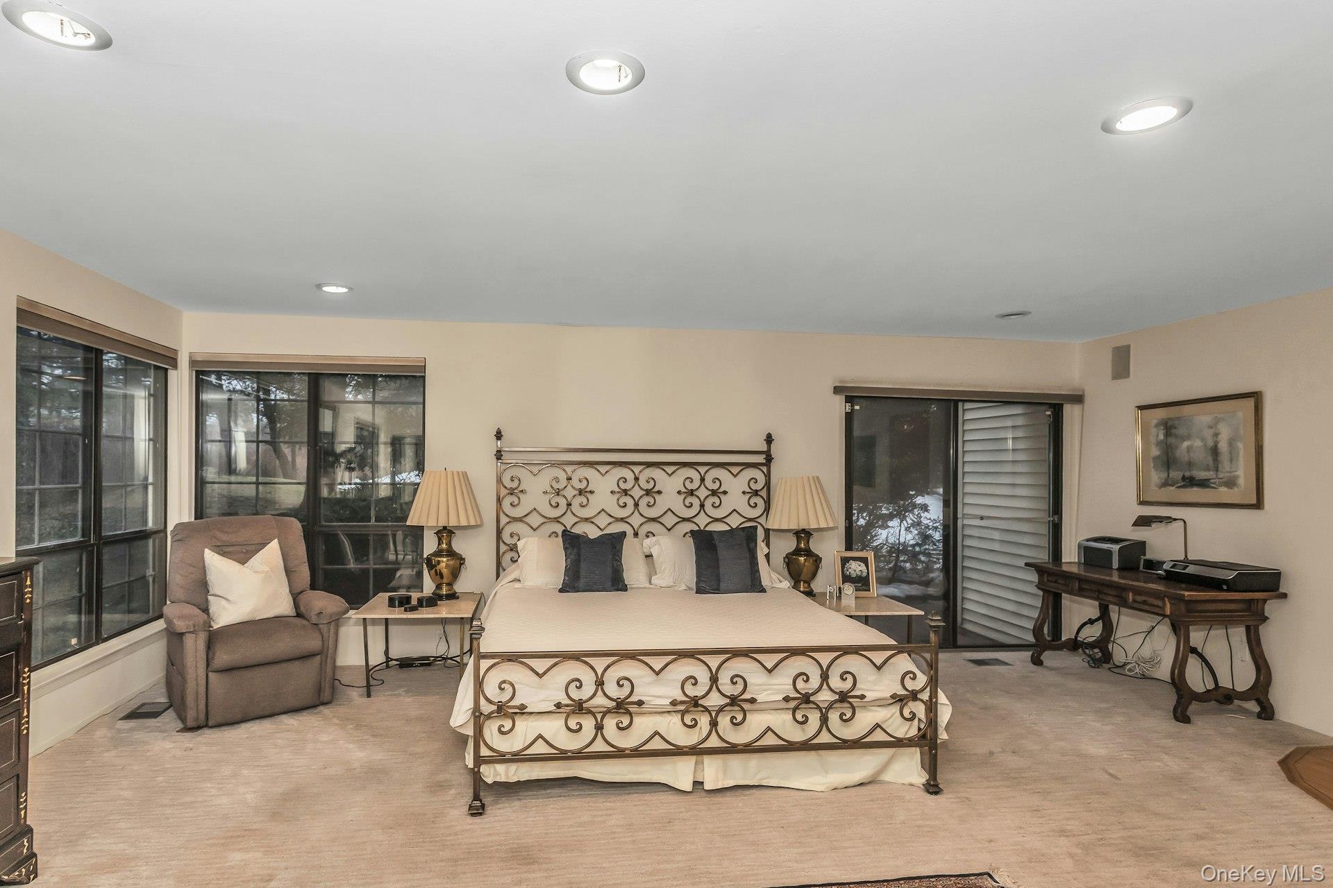 232 Linnet Court Manhasset, NY 11030 - Photo 11 of 28 a bedroom with a large bed and a window