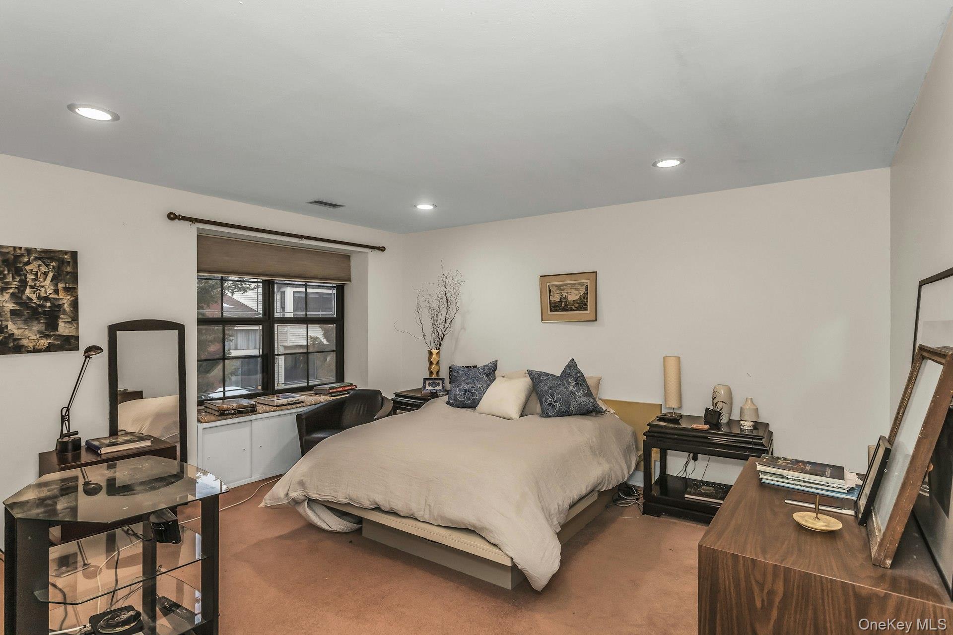 232 Linnet Court Manhasset, NY 11030 - Photo 18 of 28 a bedroom with a bed and wooden floor