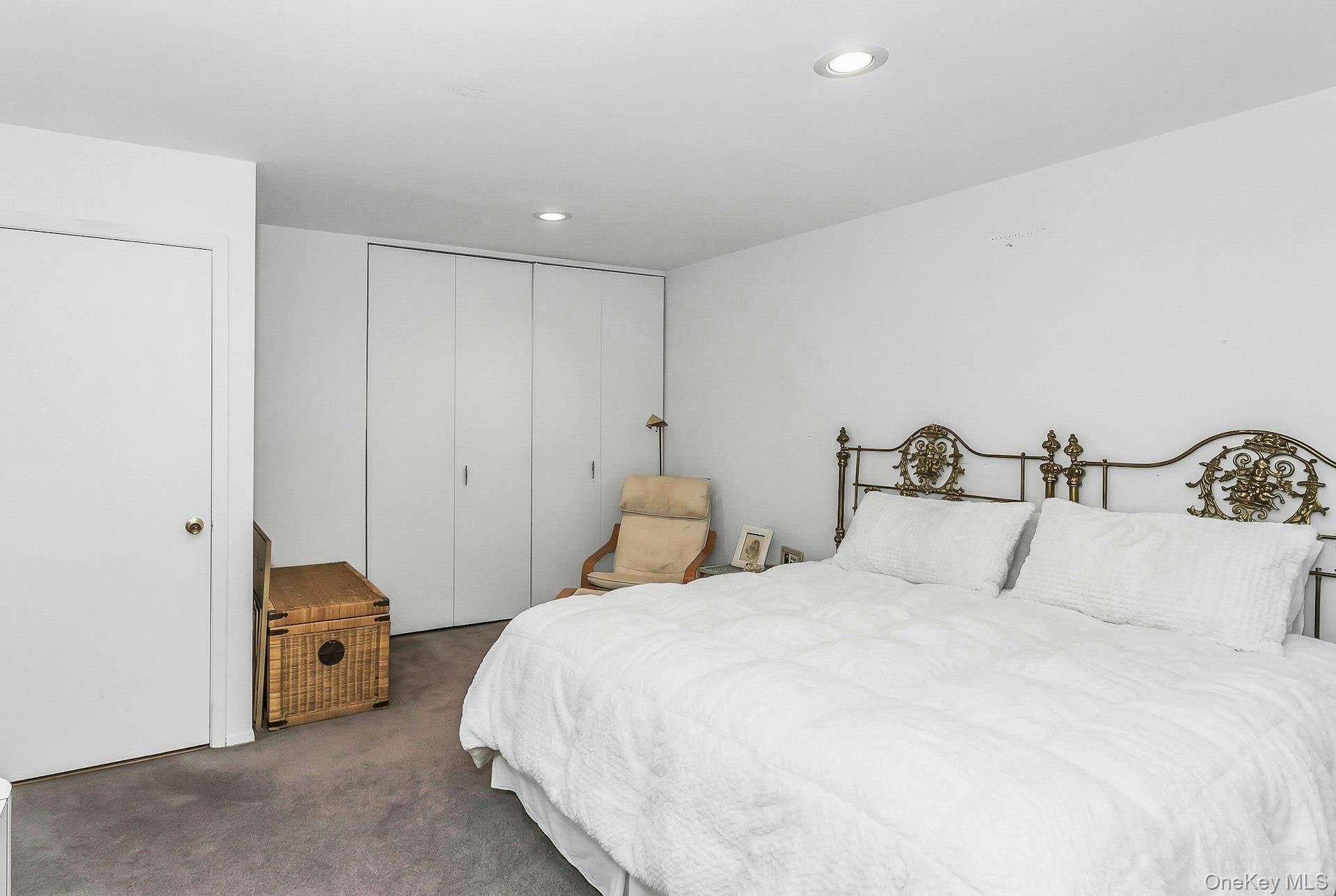 232 Linnet Court Manhasset, NY 11030 - Photo 19 of 28 a bedroom with bed and a closet