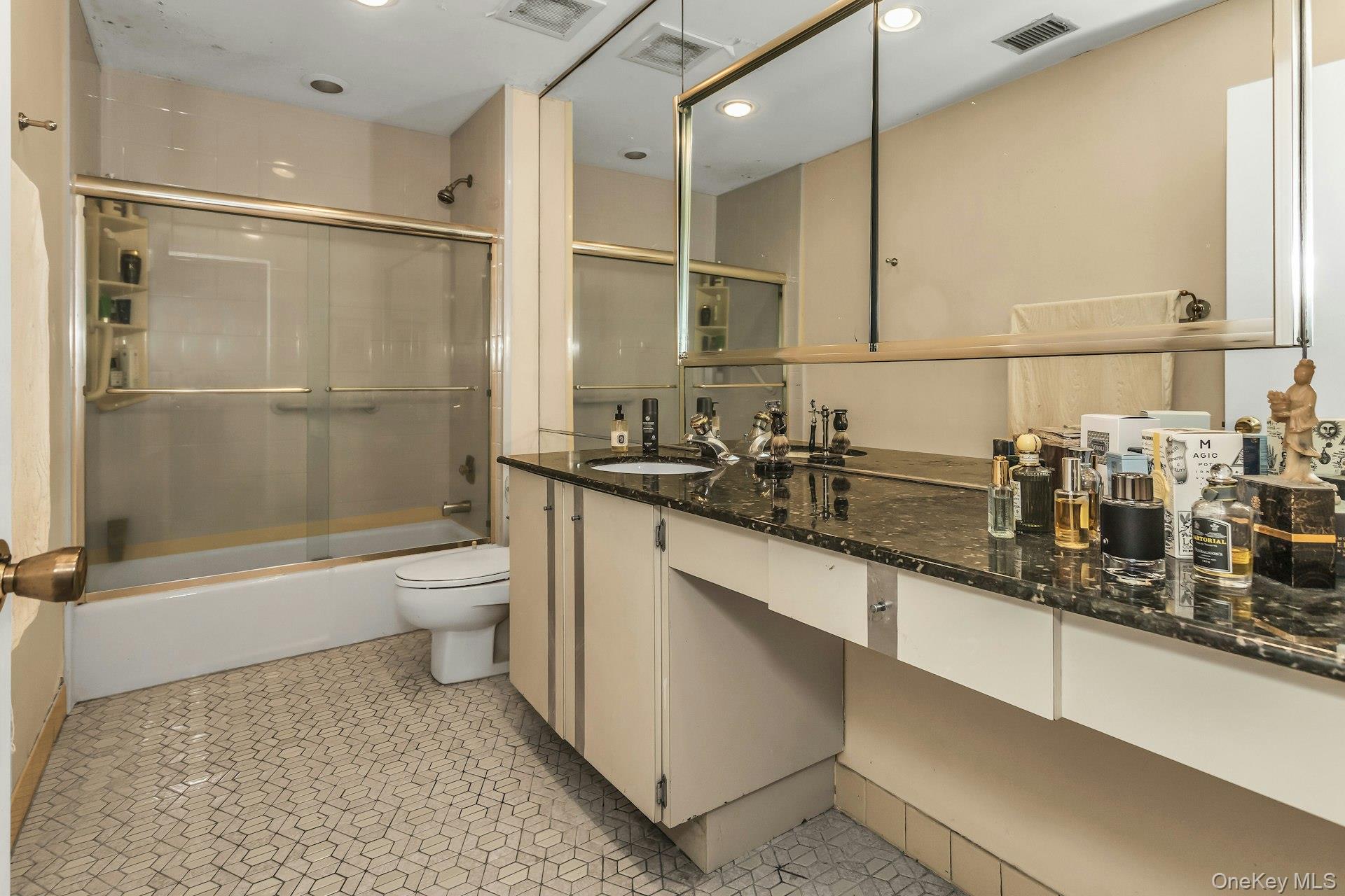 232 Linnet Court Manhasset, NY 11030 - Photo 20 of 28 a bathroom with a double vanity sink toilet and shower