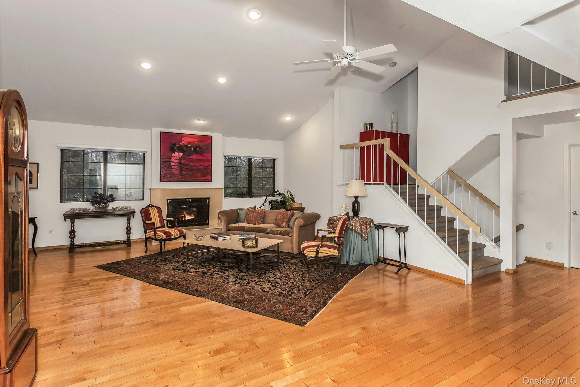 232 Linnet Court Manhasset, NY 11030 - Photo 2 of 28 a living room with furniture and a dining table with wooden floor