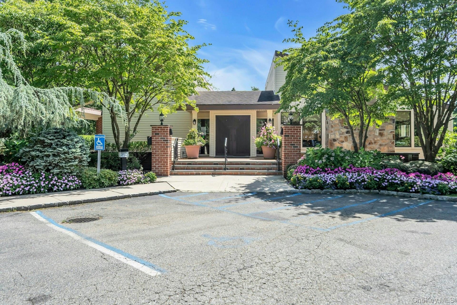 232 Linnet Court Manhasset, NY 11030 - Photo 22 of 28 front view of a house and a garden