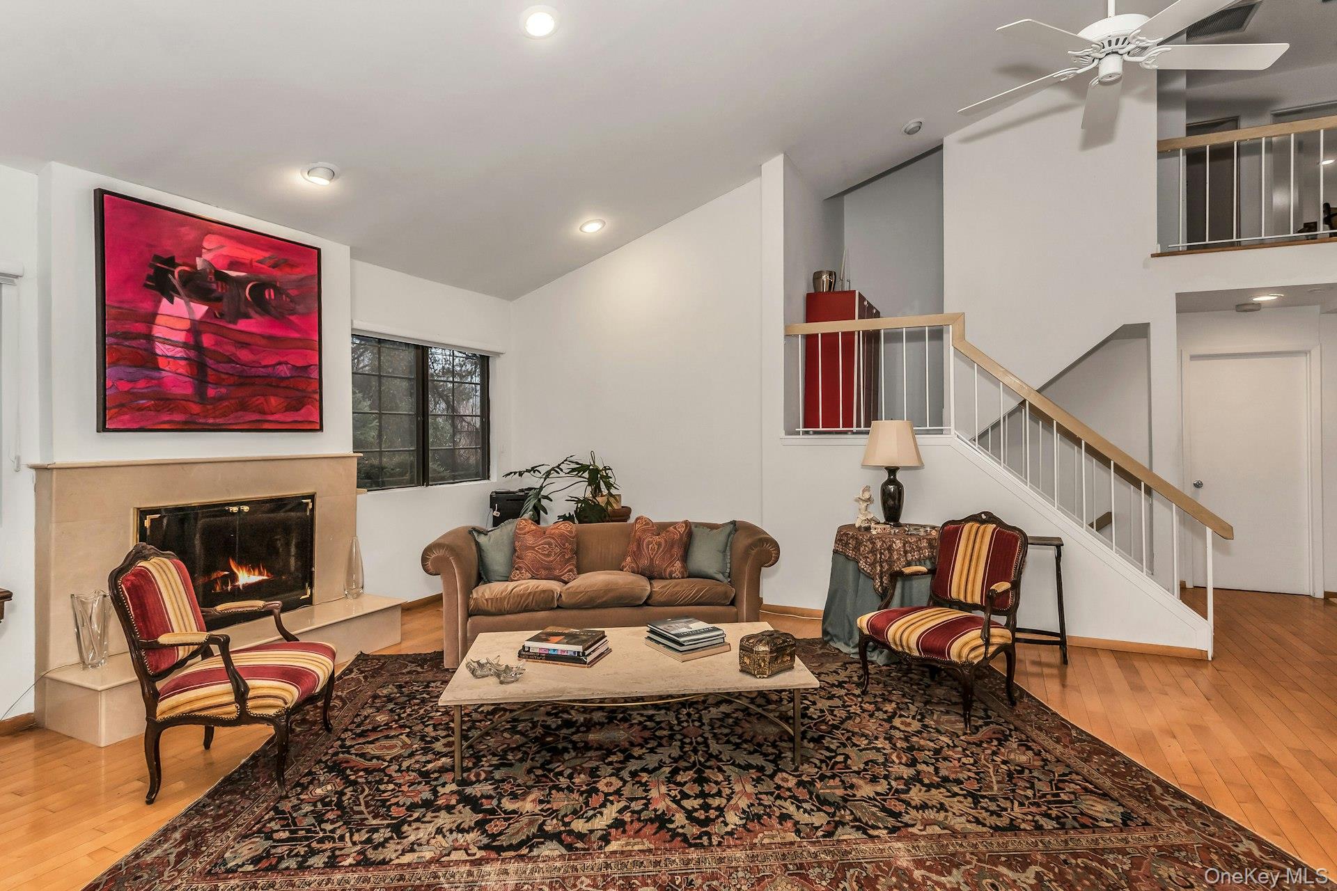 232 Linnet Court Manhasset, NY 11030 - Photo 3 of 28 a living room with furniture and a fireplace