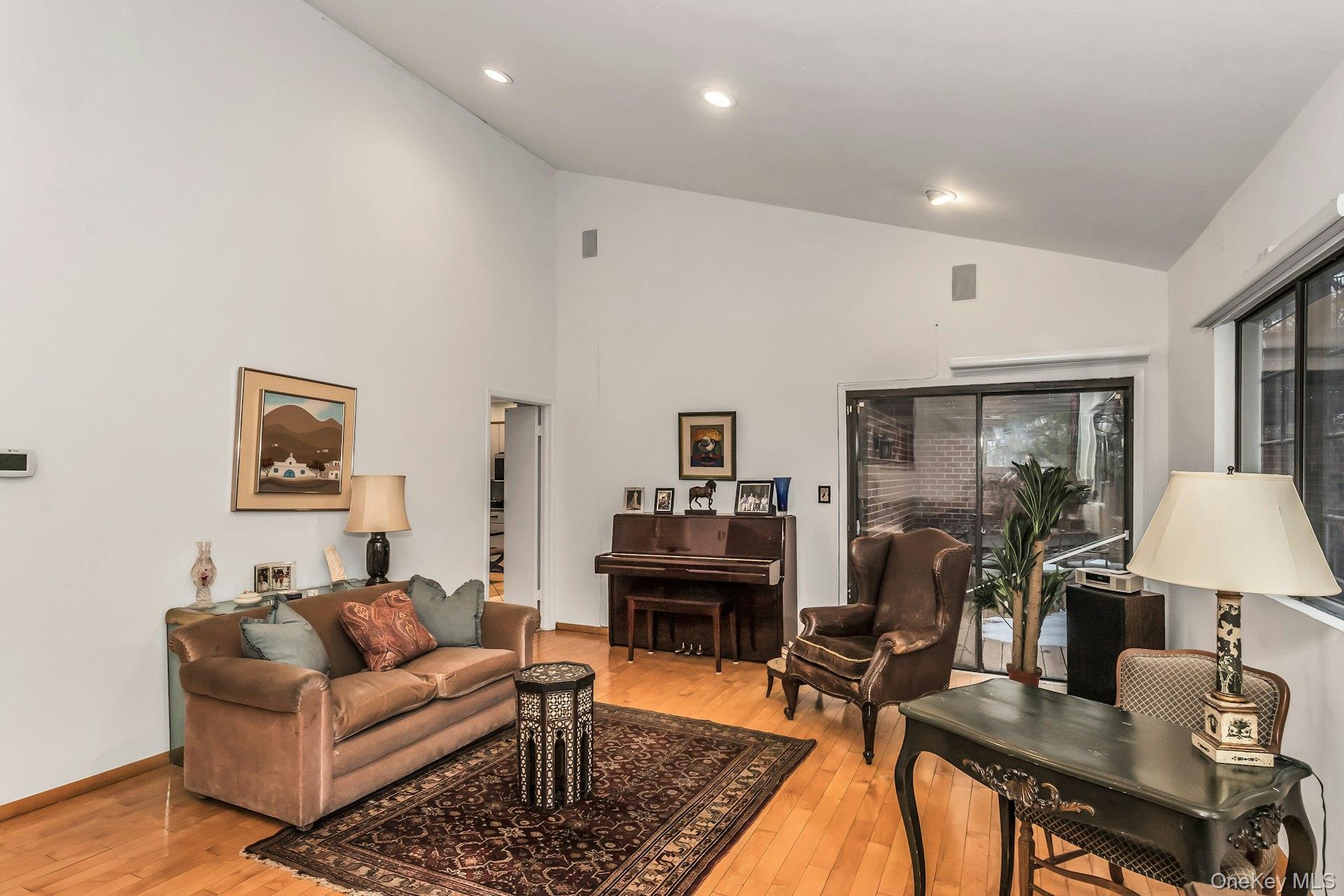 232 Linnet Court Manhasset, NY 11030 - Photo 4 of 28 a living room with furniture and a table