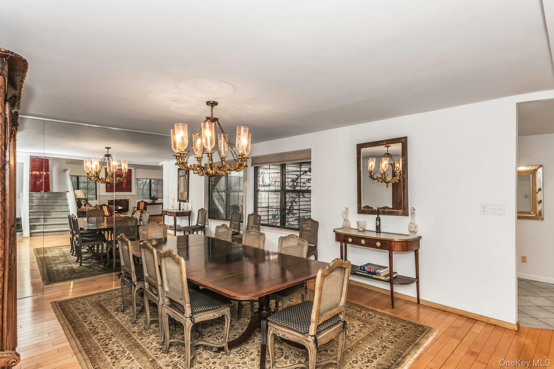 232 Linnet Court Manhasset, NY 11030 - Photo 6 of 28 a view of a dining room with furniture and chandelier