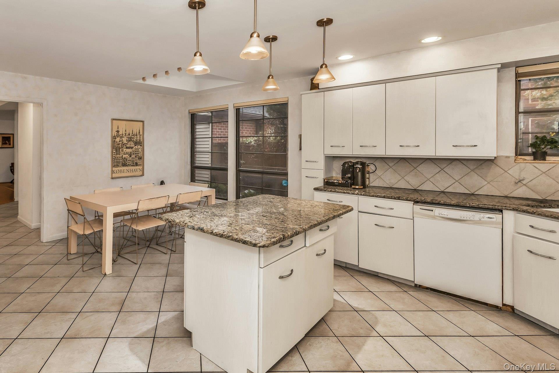 232 Linnet Court Manhasset, NY 11030 - Photo 7 of 28 a kitchen with granite countertop cabinets a sink and appliances